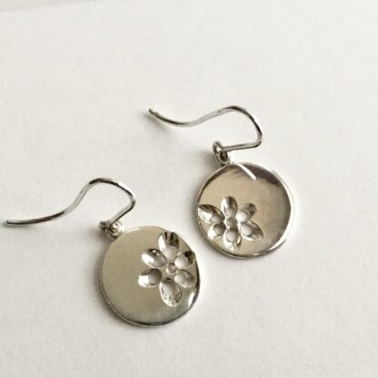 Sterling silver pierced floral disk drop earrings