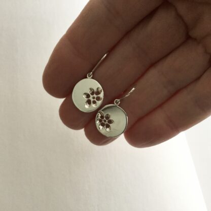 Sterling silver pierced floral disk drop earrings