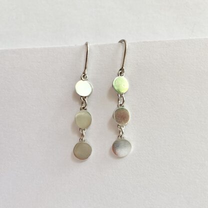 Sterling silver articulated disk drop earrings