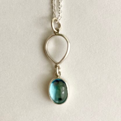 Silver and oval topaz necklace