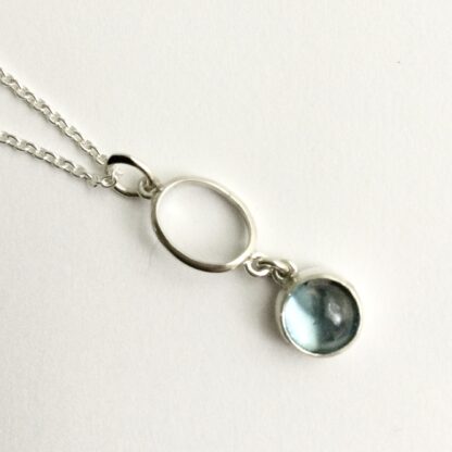 Geometric silver and topaz pendant