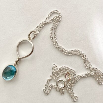 Silver and oval topaz necklace