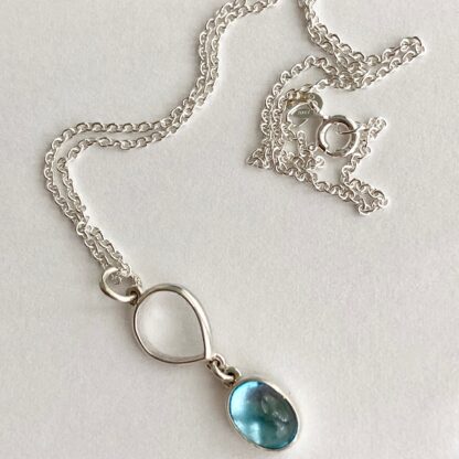 Silver and oval topaz necklace