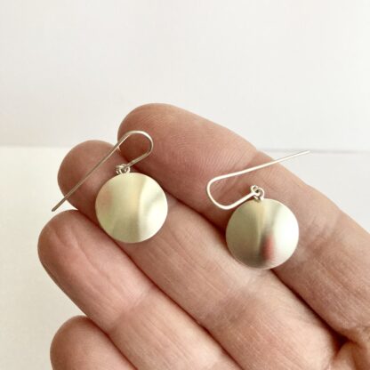 Sterling silver domed disk drop earrings